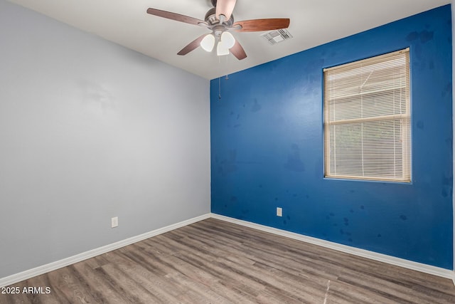 18008 W Tina Ln, Surprise, AZ 85387 - empty room featuring wood finished floors, a ceiling fan, and baseboards