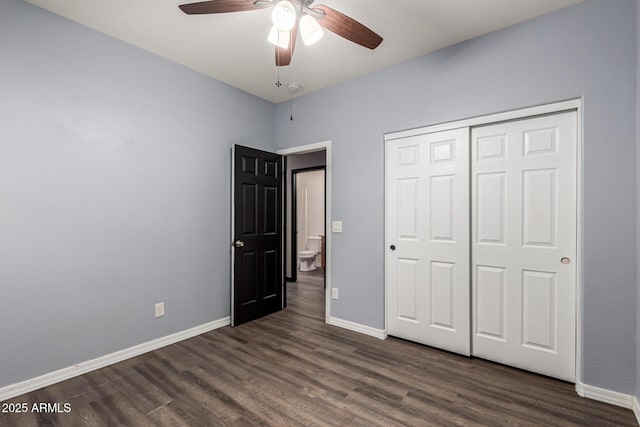 18008 W Tina Ln, Surprise, AZ 85387 - unfurnished bedroom featuring dark wood-type flooring, baseboards, and a closet