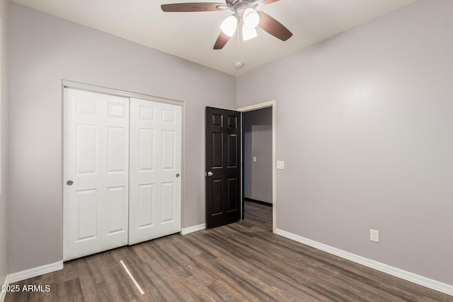 18008 W Tina Ln, Surprise, AZ 85387 - unfurnished bedroom with wood finished floors, baseboards, a closet, and ceiling fan