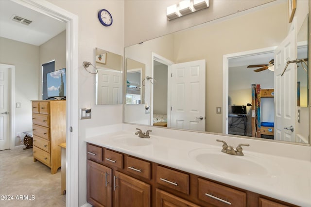 bathroom with ceiling fan and vanity