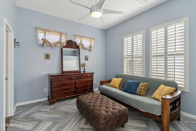 sitting room featuring ceiling fan