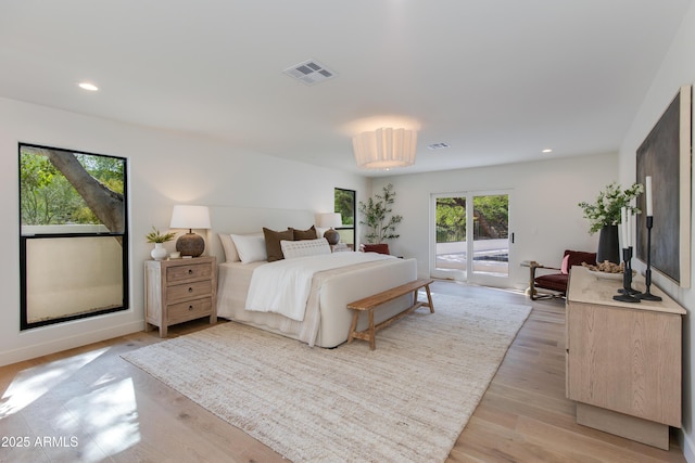 3186 E Stella Ln, Phoenix, AZ 85016 - bedroom featuring access to exterior, light wood finished floors, and recessed lighting