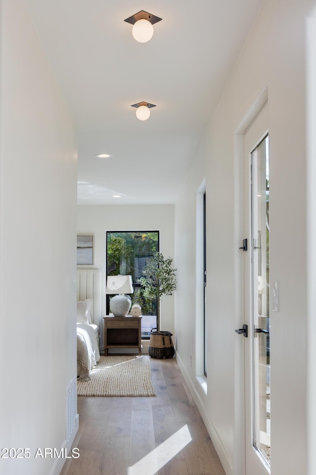3186 E Stella Ln, Phoenix, AZ 85016 - hallway with wood finished floors and baseboards