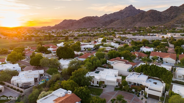 3186 E Stella Ln, Phoenix, AZ 85016 - aerial view at dusk of a residential view and a mountain view