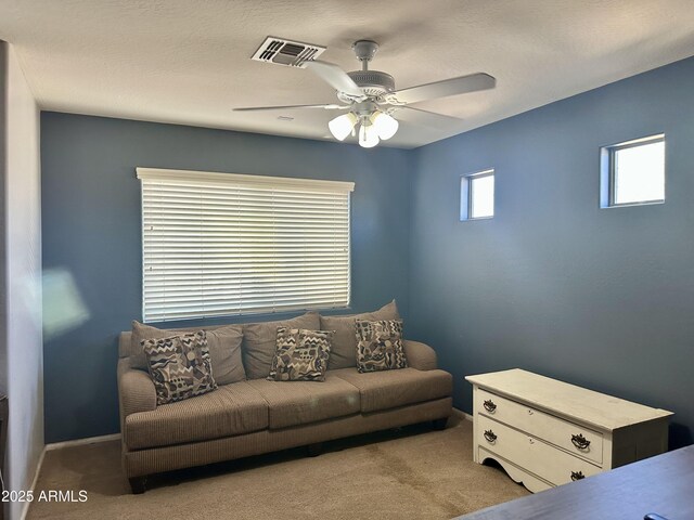 491 E Jeanne Ln, San Tan Valley, AZ 85140 - carpeted living area featuring ceiling fan and baseboards
