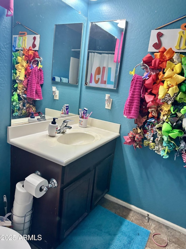 491 E Jeanne Ln, San Tan Valley, AZ 85140 - bathroom with vanity, tile patterned floors, and baseboards