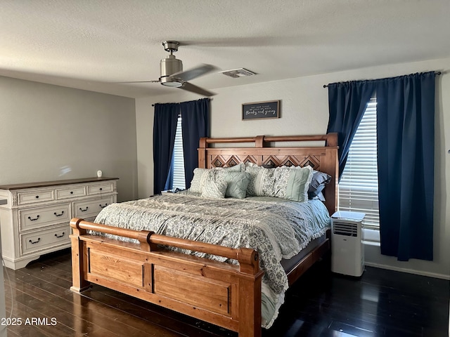491 E Jeanne Ln, San Tan Valley, AZ 85140 - bedroom featuring dark wood-style flooring, a textured ceiling, and a ceiling fan