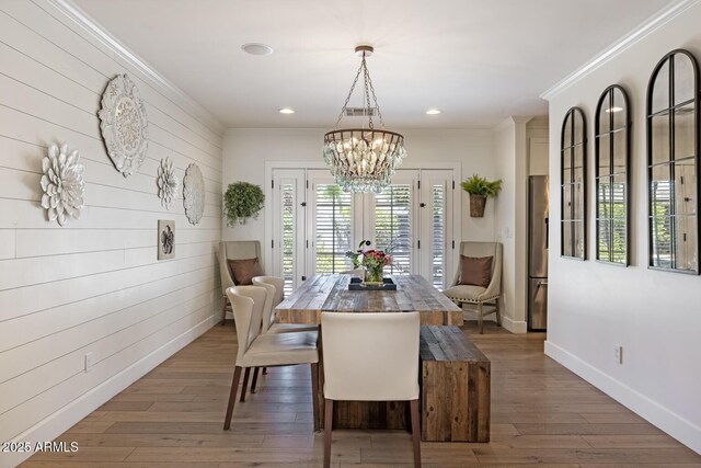 3308 N 51st St, Phoenix, AZ 85018 - dining area with a chandelier, crown molding, hardwood / wood-style floors, recessed lighting, and baseboards