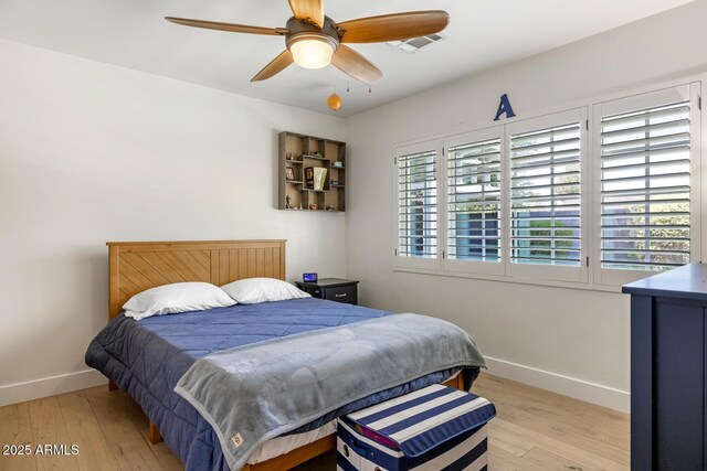 3308 N 51st St, Phoenix, AZ 85018 - bedroom featuring baseboards, wood-type flooring, and ceiling fan