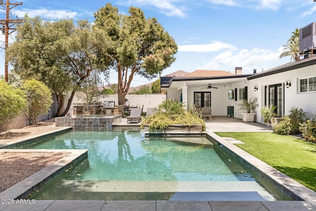 3308 N 51st St, Phoenix, AZ 85018 - view of pool featuring french doors, an outdoor kitchen, a patio area, ceiling fan, and cooling unit