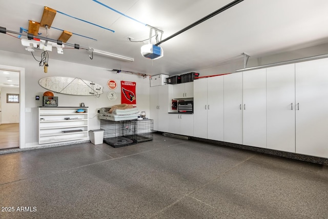 3308 N 51st St, Phoenix, AZ 85018 - garage with a garage door opener and baseboards