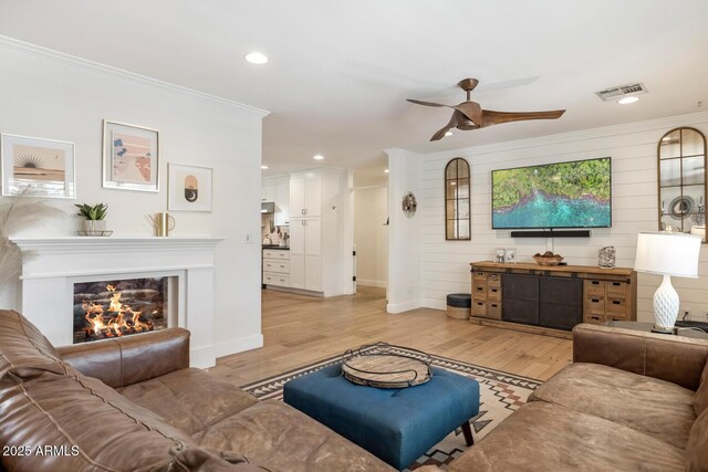 3308 N 51st St, Phoenix, AZ 85018 - living area with a ceiling fan, light wood-style floors, crown molding, baseboards, and recessed lighting