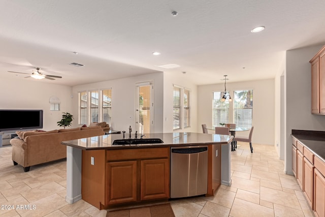 kitchen featuring stainless steel dishwasher, decorative light fixtures, plenty of natural light, and ceiling fan with notable chandelier