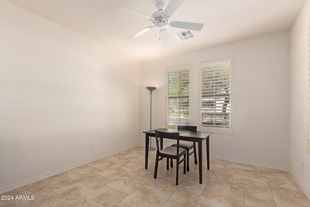 dining room featuring ceiling fan