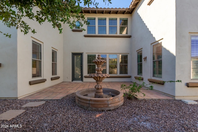 rear view of property with a patio