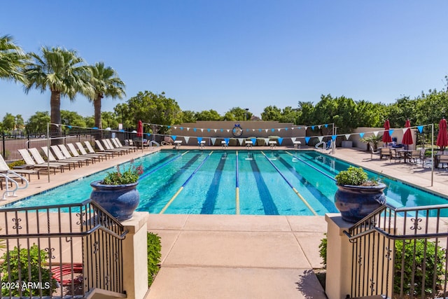 view of pool featuring a patio