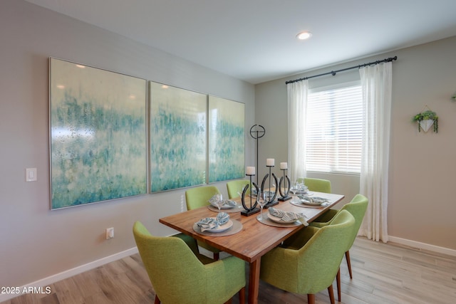 dining space featuring light wood-type flooring