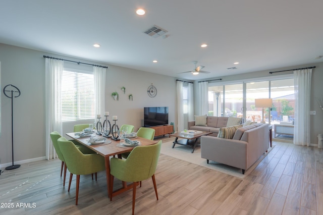 dining area featuring ceiling fan and light hardwood / wood-style floors