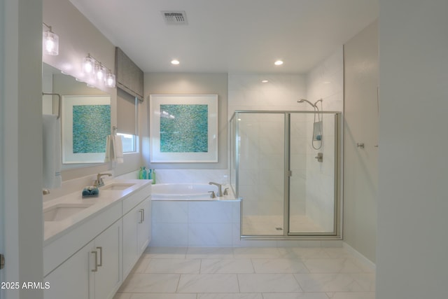 bathroom featuring vanity and separate shower and tub