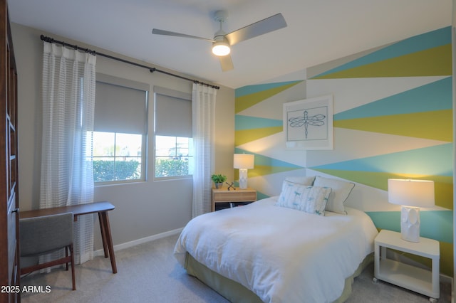 bedroom featuring light colored carpet and ceiling fan