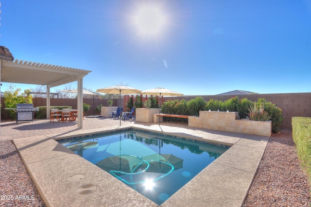 view of swimming pool featuring area for grilling, a pergola, and a patio