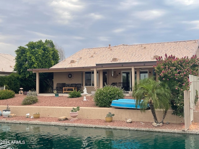 rear view of property featuring a patio