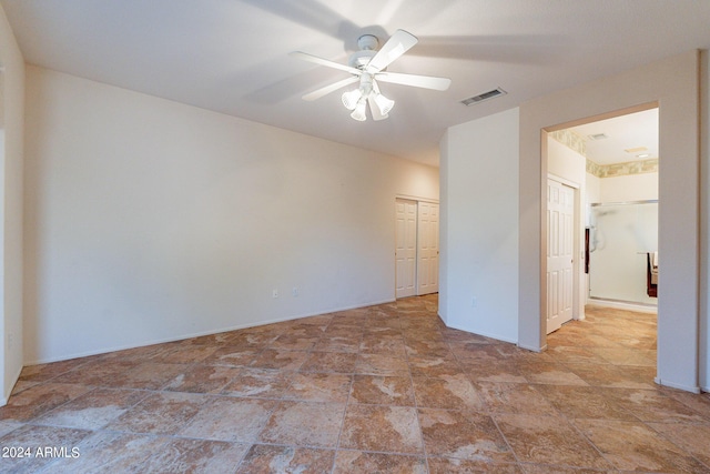 spare room featuring ceiling fan