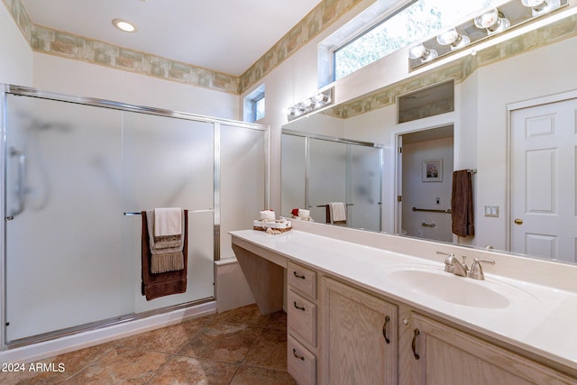 bathroom with vanity and an enclosed shower