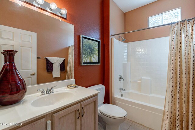 full bathroom with vanity, shower / tub combo, tile patterned floors, and toilet