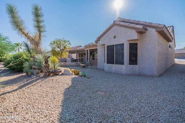 back of property featuring a patio area