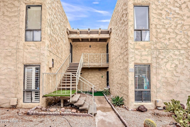 view of property featuring stairs