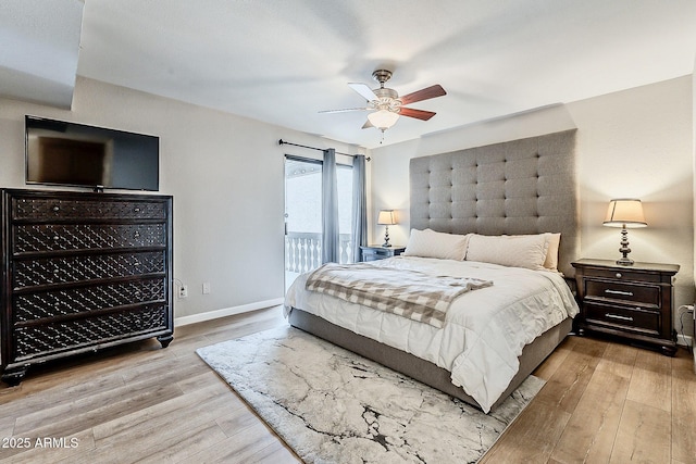 bedroom with a ceiling fan, access to exterior, wood finished floors, and baseboards