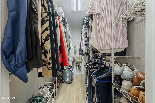 spacious closet with wood finished floors