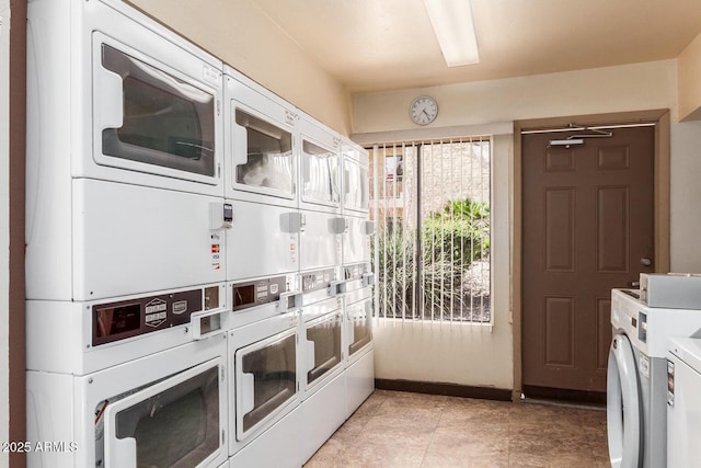 common laundry area with stacked washer and dryer, separate washer and dryer, and baseboards