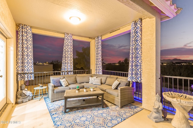 patio terrace at dusk with outdoor lounge area