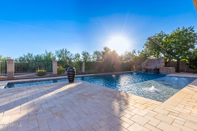 view of pool featuring a patio area and pool water feature