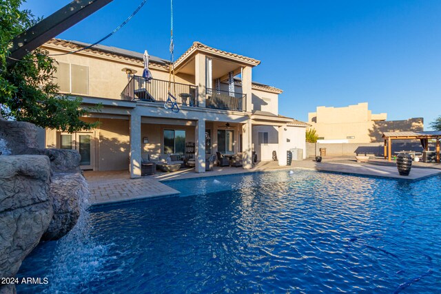 view of swimming pool featuring a patio