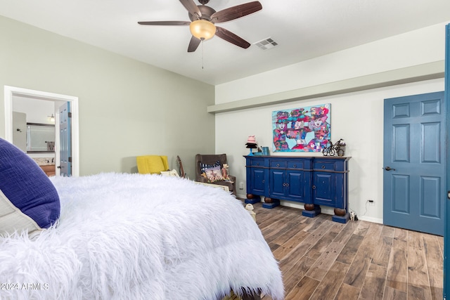 bedroom with connected bathroom, ceiling fan, and dark hardwood / wood-style floors