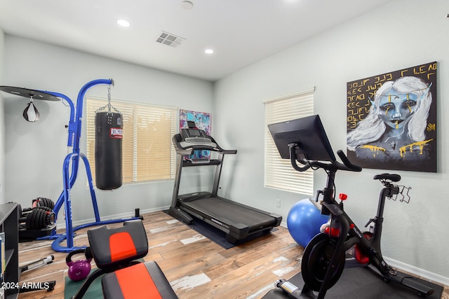 workout area with wood-type flooring