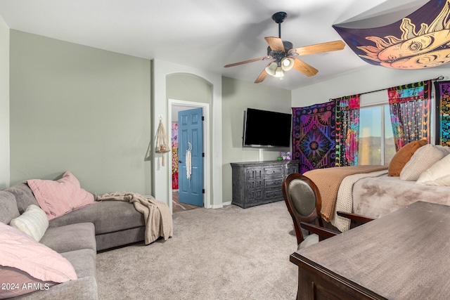 bedroom with ceiling fan and light carpet