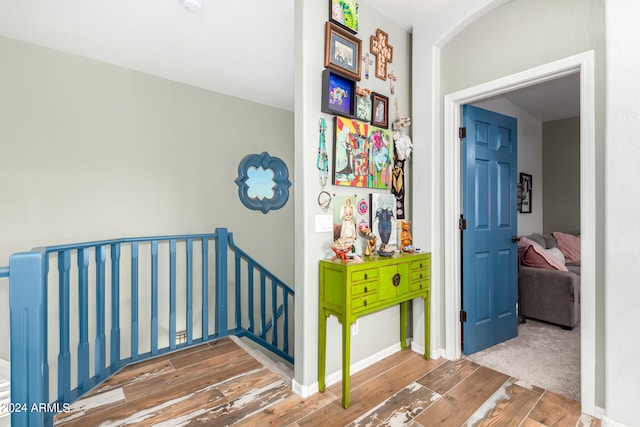 hallway featuring hardwood / wood-style flooring