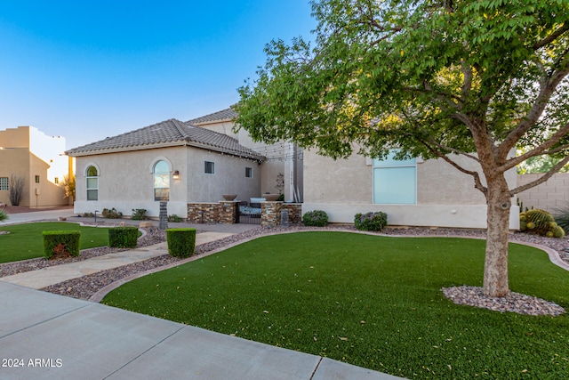 view of front of home with a front yard