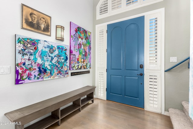 entryway with hardwood / wood-style flooring