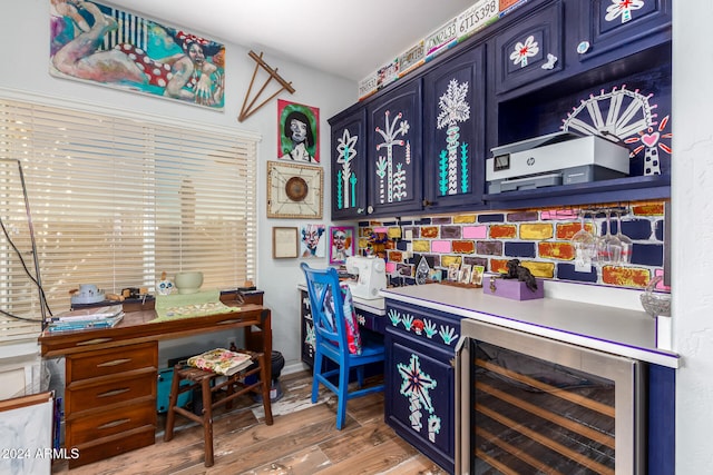 bar featuring wine cooler, hardwood / wood-style flooring, and decorative backsplash