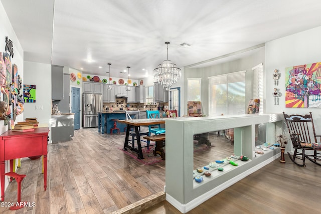 interior space featuring a notable chandelier and dark hardwood / wood-style floors