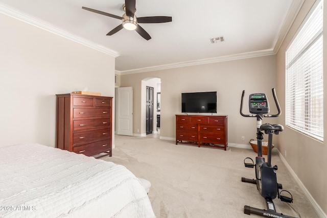 bedroom featuring ceiling fan, light colored carpet, and ornamental molding