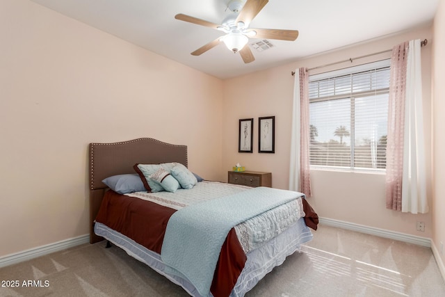 bedroom with ceiling fan and carpet