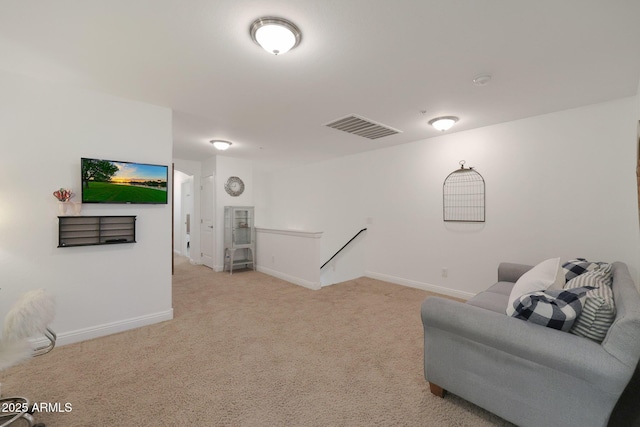 sitting room with an upstairs landing, visible vents, light colored carpet, and baseboards