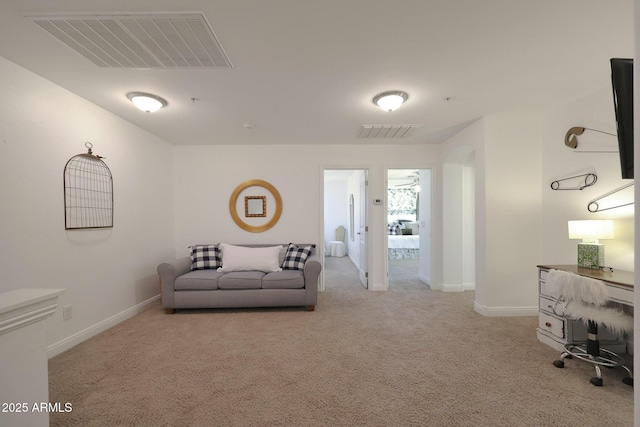 carpeted office featuring visible vents and baseboards