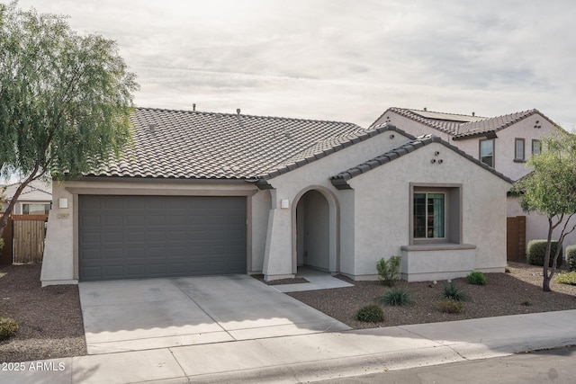 mediterranean / spanish-style house featuring a garage